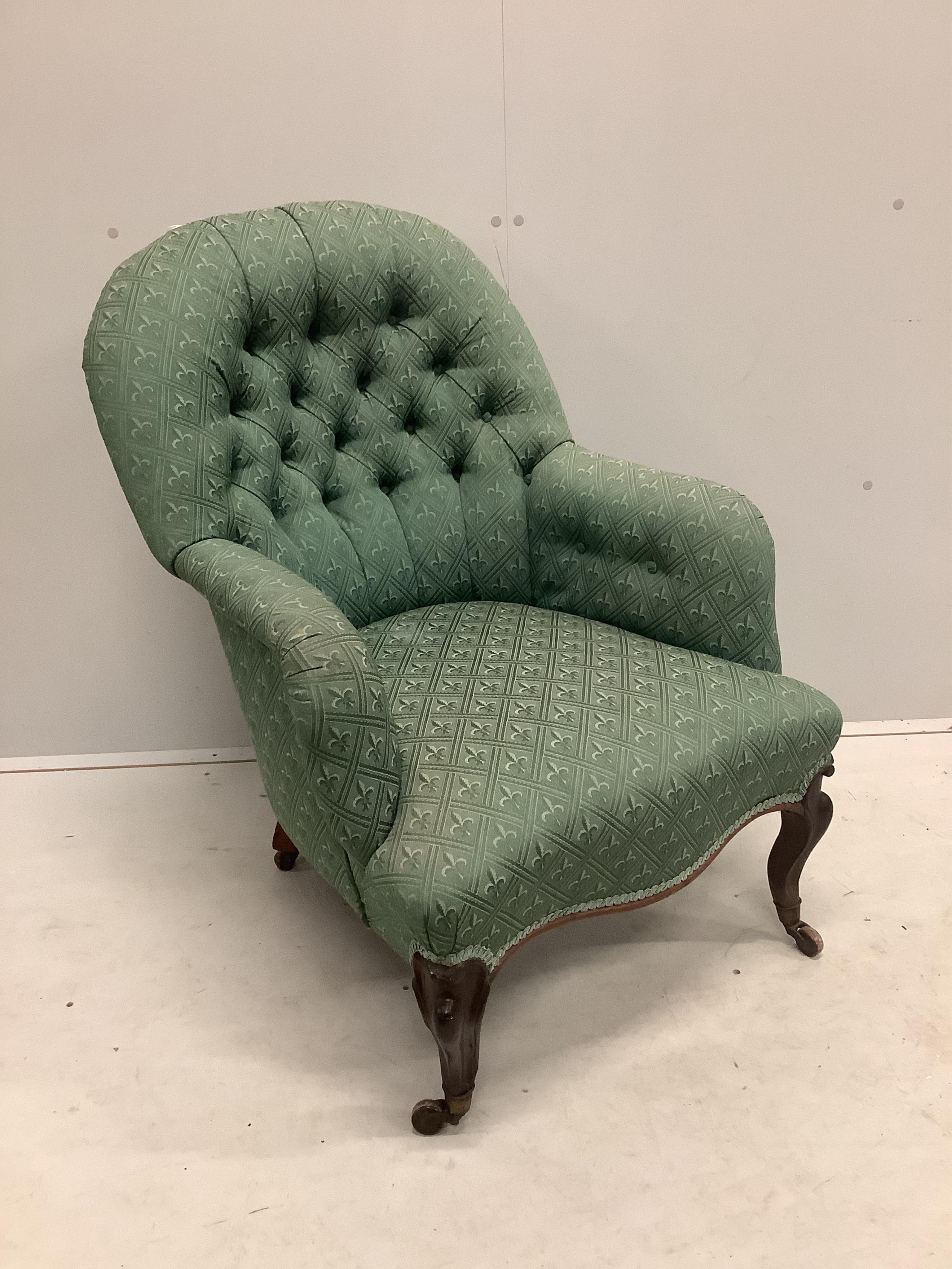 A Victorian rosewood spoonback armchair, width 68cm, depth 68cm, height 90cm. Condition - fair